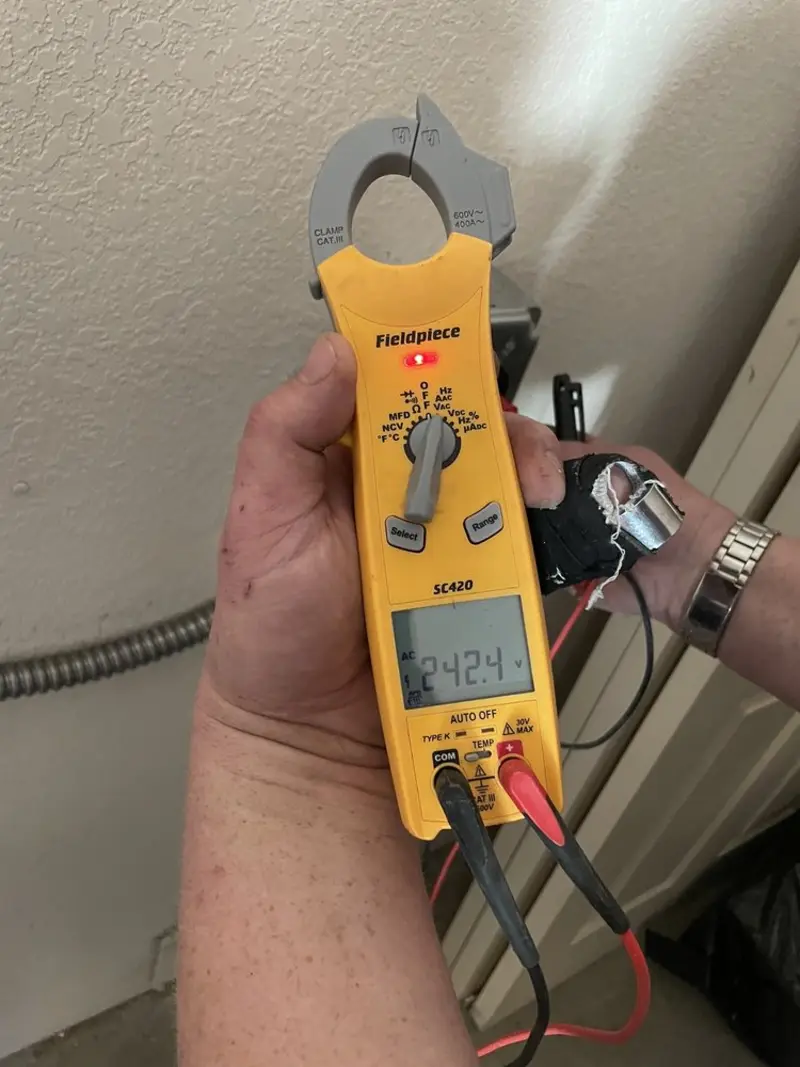 Voltage testing with clamp meter during Ceiling Fan Installation in Sadsbury